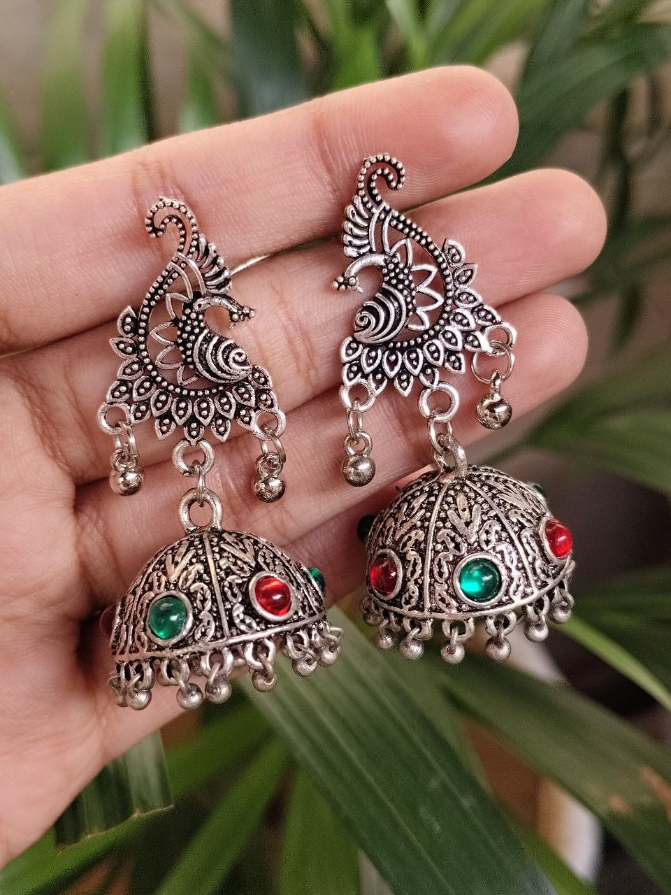 Oxidized Peacock Jhumka Dangler Earrings With Elegant Stone Work Design
